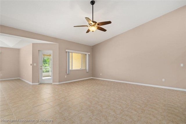 6918 San Benito Dr, Sebring, FL 33872 - spare room featuring ceiling fan, light tile patterned floors, vaulted ceiling, and baseboards