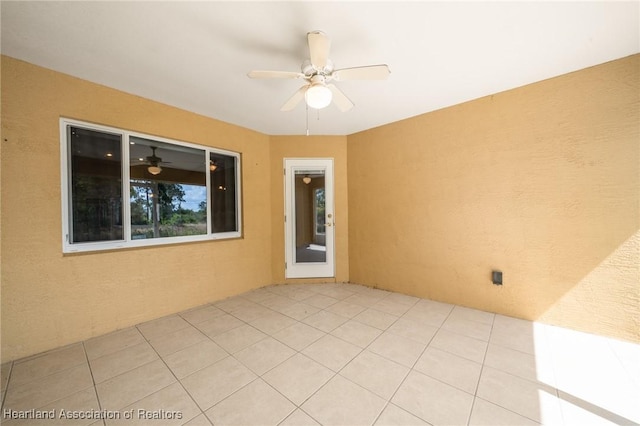 6918 San Benito Dr, Sebring, FL 33872 - spare room with a ceiling fan and light tile patterned flooring