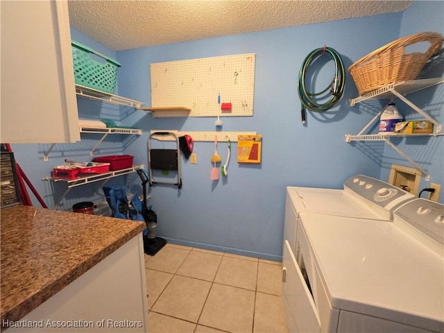 4730 Granada Blvd, Sebring, FL 33872 - laundry area featuring washing machine and dryer, a textured ceiling, and light tile patterned floors