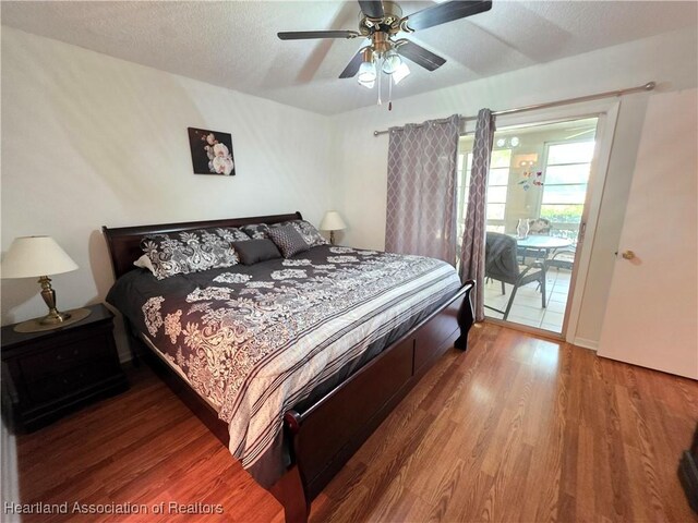4730 Granada Blvd, Sebring, FL 33872 - bedroom with access to exterior, wood finished floors, a ceiling fan, and a textured ceiling