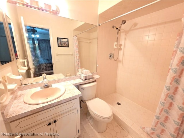 4730 Granada Blvd, Sebring, FL 33872 - bathroom featuring tile patterned floors, tiled shower, vanity, and a ceiling fan
