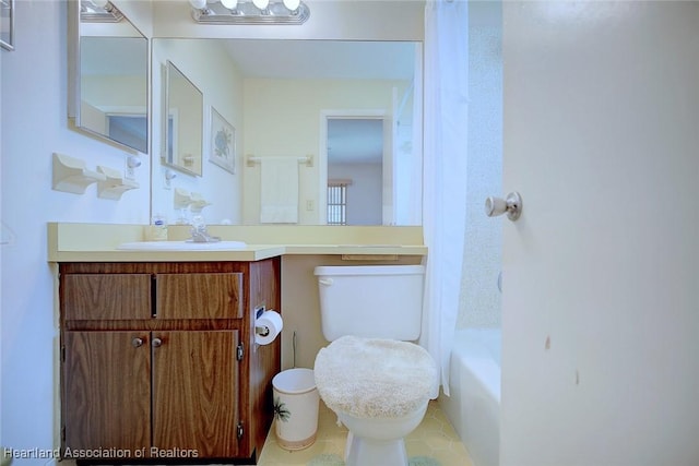 full bathroom with vanity, toilet, and shower / bath combo