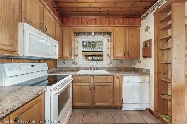 kitchen featuring light tile patterned floors, white appliances, wooden ceiling, and sink