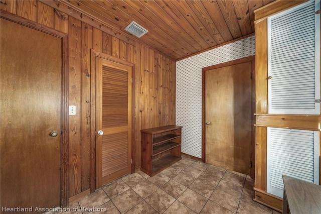 corridor with wooden walls and wood ceiling