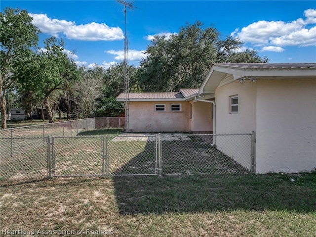 view of home's exterior with a lawn