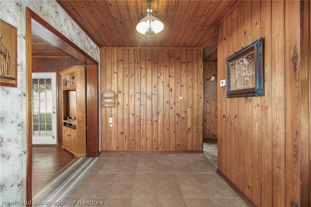 corridor with wood ceiling and wood walls