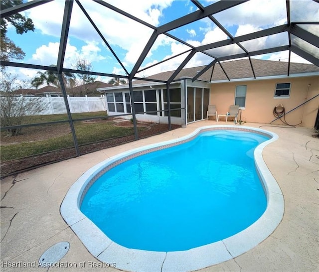 4225 Mandarin Rd, Sebring, FL 33875 - view of pool featuring a sunroom, fence, glass enclosure, a fenced in pool, and a patio area