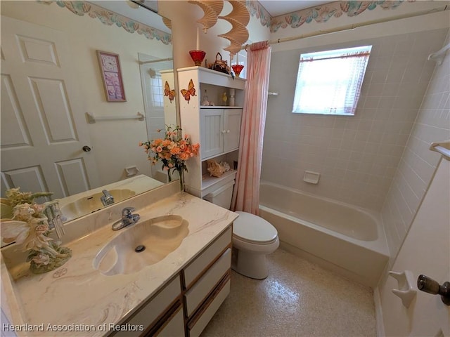 full bathroom with vanity, shower / bath combo, and toilet