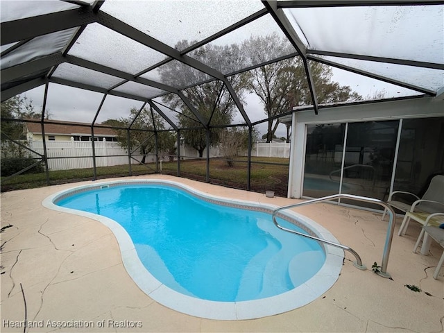 view of pool with a lanai and a patio area