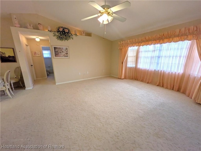 4225 Mandarin Rd, Sebring, FL 33875 - empty room featuring lofted ceiling, ceiling fan, and light colored carpet