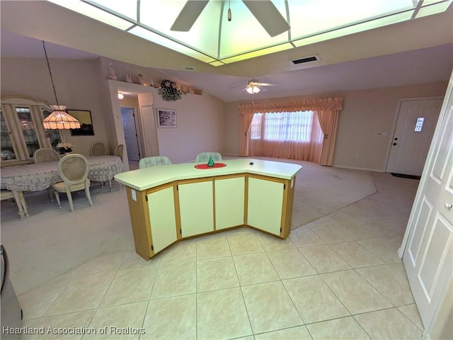 4225 Mandarin Rd, Sebring, FL 33875 - kitchen featuring lofted ceiling, ceiling fan, visible vents, and light carpet