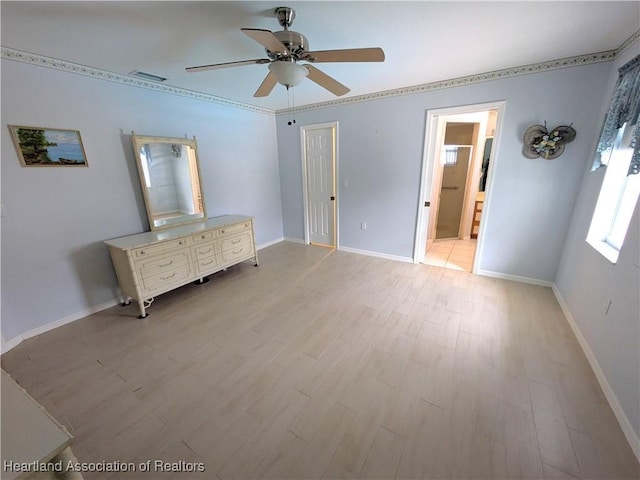 unfurnished bedroom with ensuite bath, ceiling fan, and light hardwood / wood-style floors