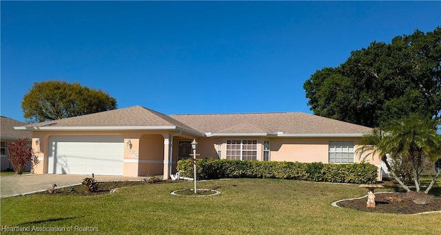 ranch-style home with a front lawn, concrete driveway, a garage, and stucco siding