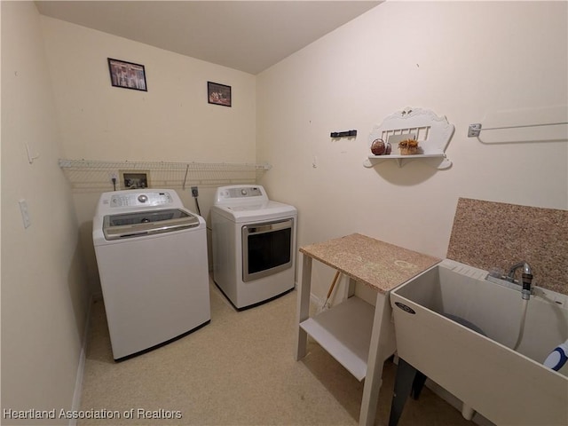 laundry area with sink and washer and dryer