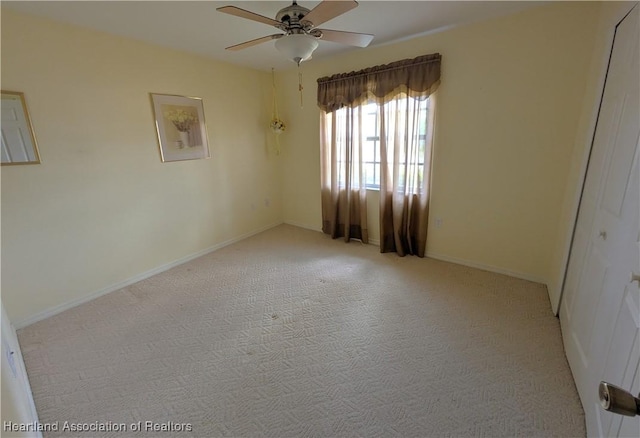 4225 Mandarin Rd, Sebring, FL 33875 - spare room featuring a ceiling fan, baseboards, and light colored carpet