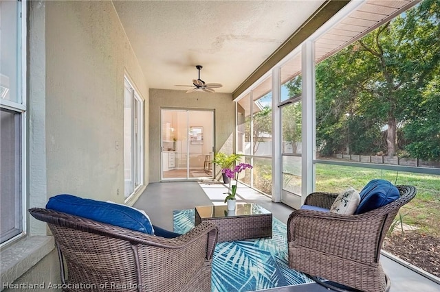 sunroom / solarium with ceiling fan