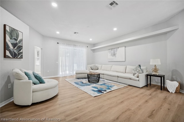 living room with light hardwood / wood-style floors