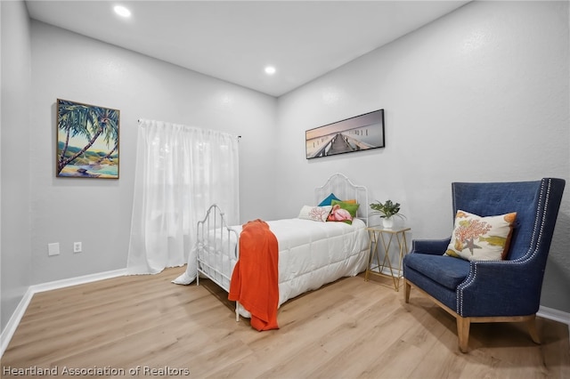 bedroom with light hardwood / wood-style floors