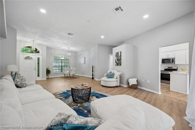 living room with light hardwood / wood-style flooring