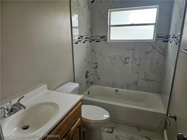 full bathroom featuring vanity, toilet, and tiled shower / bath