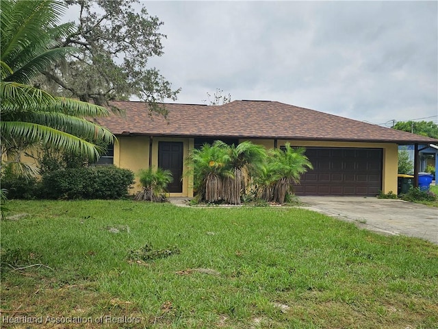 single story home with a garage and a front lawn