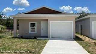 view of front facade featuring an attached garage and driveway