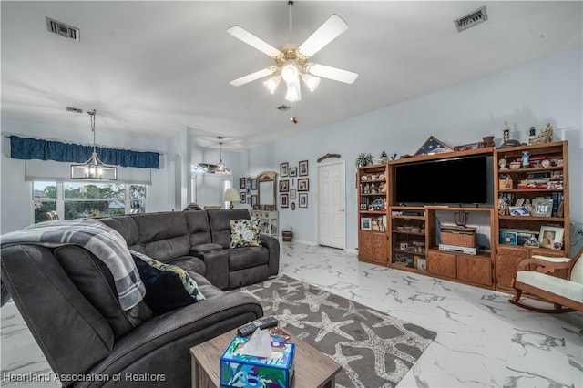 living room with ceiling fan with notable chandelier, marble finish floor, and visible vents