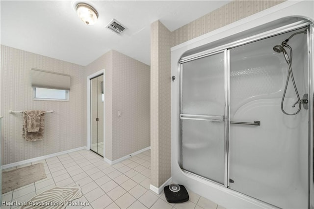 bathroom with wallpapered walls, visible vents, baseboards, tile patterned floors, and a shower stall