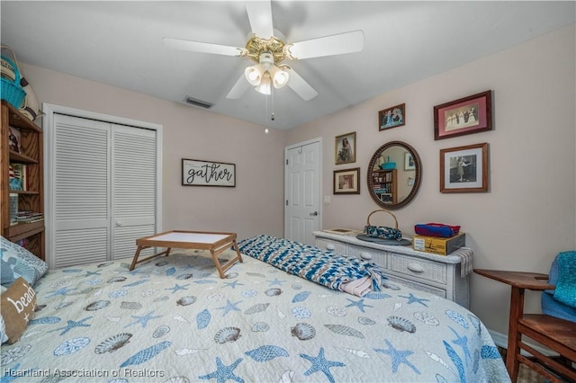 bedroom with a ceiling fan, visible vents, and a closet