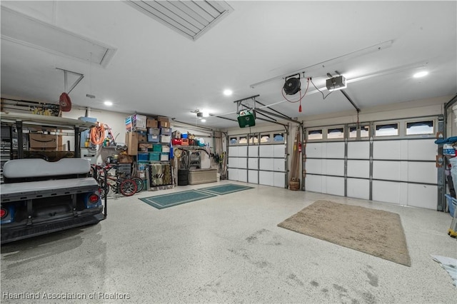 garage featuring a garage door opener