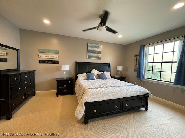 carpeted bedroom featuring ceiling fan