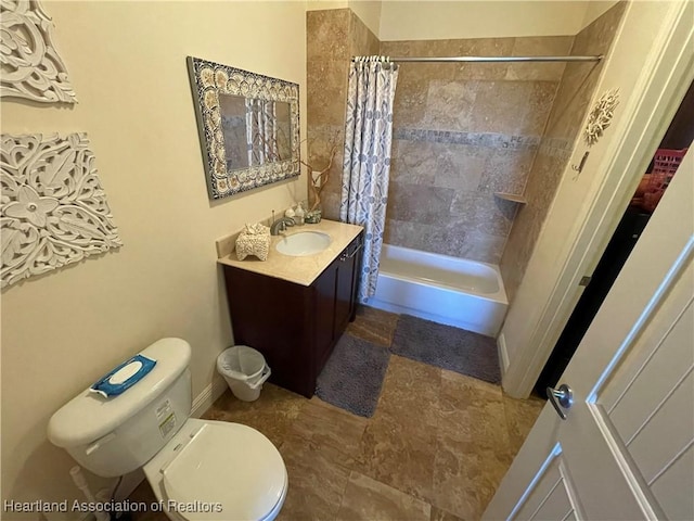 full bathroom with shower / tub combo, vanity, and toilet