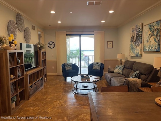 living room featuring crown molding