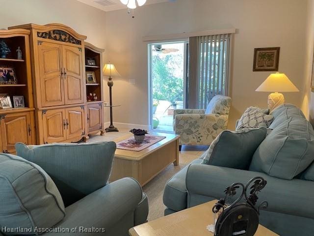 living room featuring ceiling fan and light colored carpet