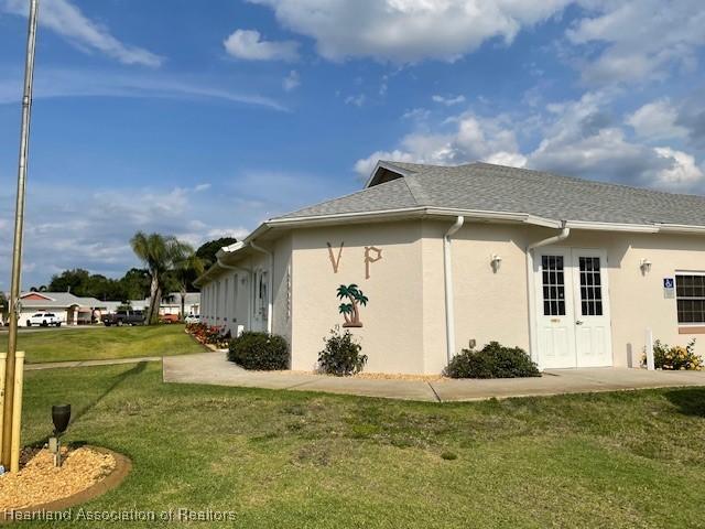 view of property exterior featuring a lawn