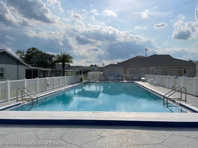 view of swimming pool with a patio