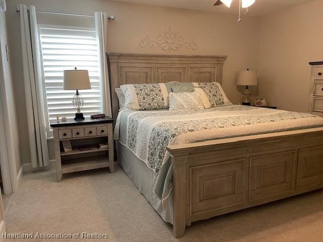 carpeted bedroom featuring ceiling fan