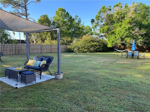 view of yard featuring a patio and fence