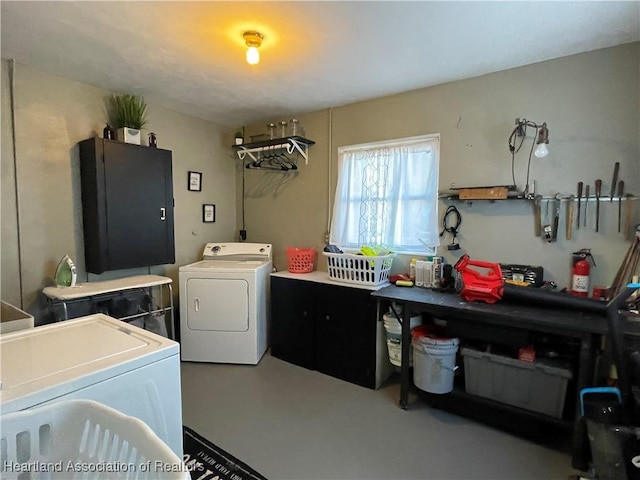 washroom with washer and clothes dryer and laundry area