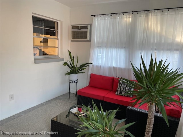 living room with carpet and a wall unit AC