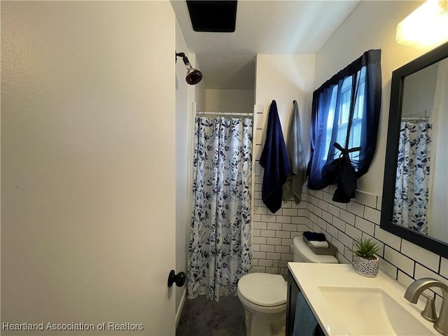 full bathroom featuring a shower with curtain, toilet, tile walls, and vanity