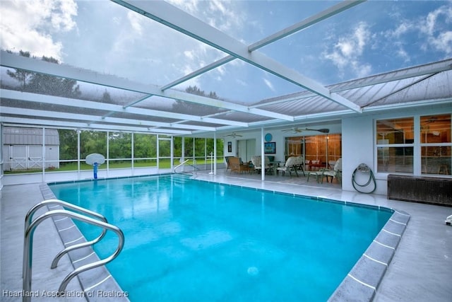 134 Bimini St NE, Lake Placid, FL 33852 - swimming pool with ceiling fan, a patio area, and glass enclosure