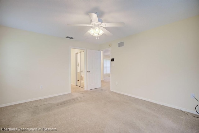 134 Bimini St NE, Lake Placid, FL 33852 - unfurnished room featuring light colored carpet, ceiling fan, and baseboards