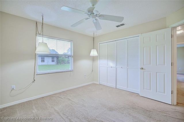 134 Bimini St NE, Lake Placid, FL 33852 - unfurnished bedroom with carpet floors, a closet, baseboards, and ceiling fan