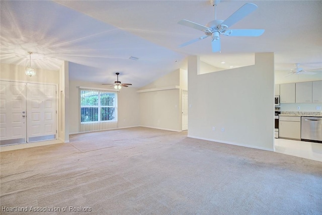 134 Bimini St NE, Lake Placid, FL 33852 - unfurnished living room featuring a ceiling fan, vaulted ceiling, light carpet, and baseboards