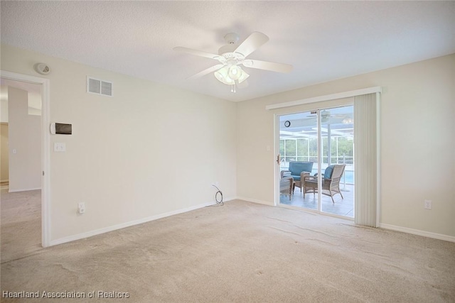 134 Bimini St NE, Lake Placid, FL 33852 - empty room with carpet, a ceiling fan, baseboards, and a smoke detector