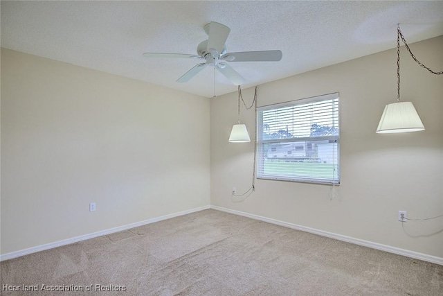 134 Bimini St NE, Lake Placid, FL 33852 - carpeted spare room featuring ceiling fan, baseboards, and a textured ceiling