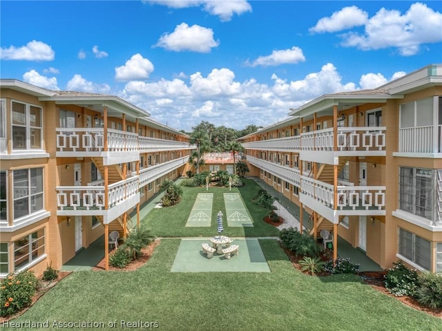 view of community featuring a lawn