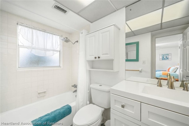 full bathroom with vanity, shower / bath combo, and toilet