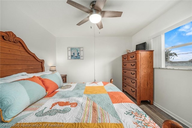 bedroom featuring hardwood / wood-style floors and ceiling fan